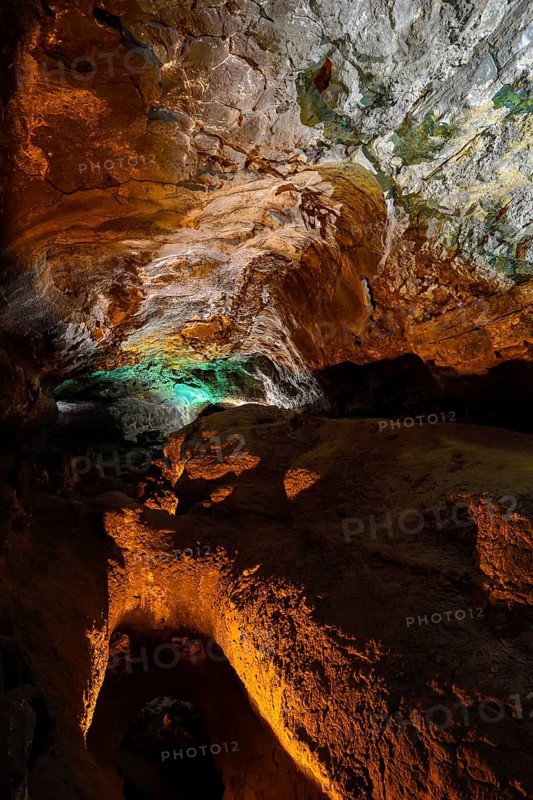 Colourfully illuminated areas of the Cueva de los Verdes