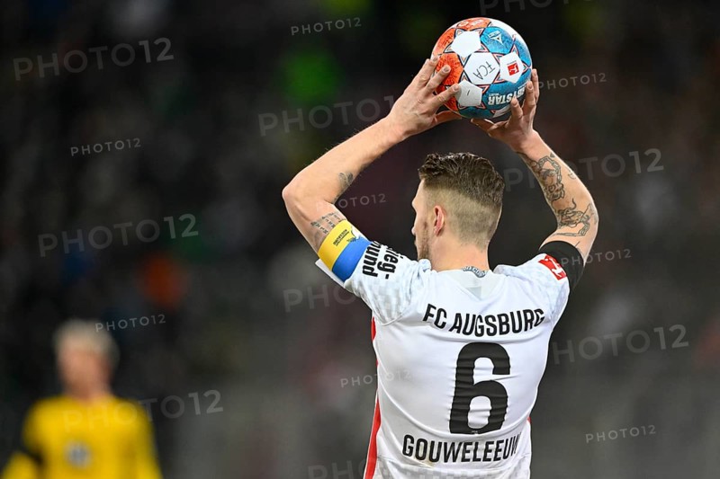 Jeffrey Gouweleeuw FC Augsburg FCA with captain's armband in the national colours of Ukraine