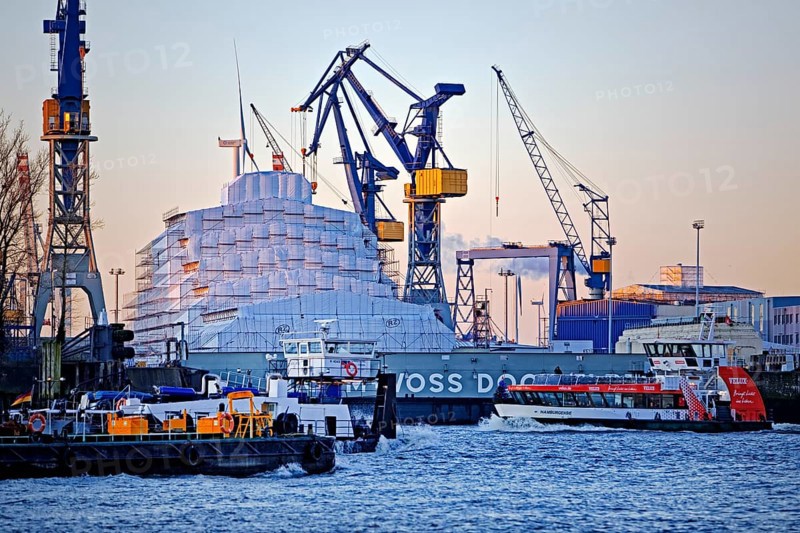Dry dock Elbe 17 by Blohm and Voss with cranes and shipping traffic on the Norderelbe