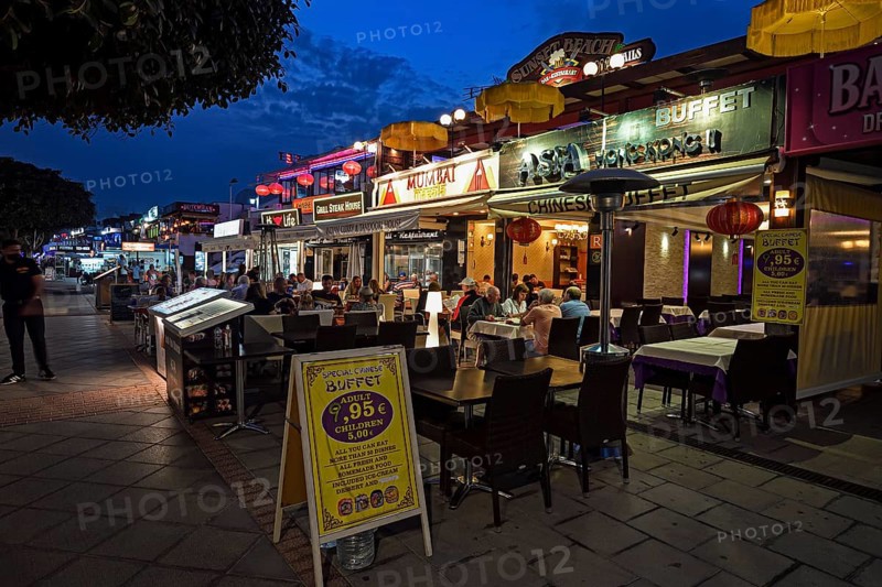 Shops and restaurants in the evening on the beach promenade
