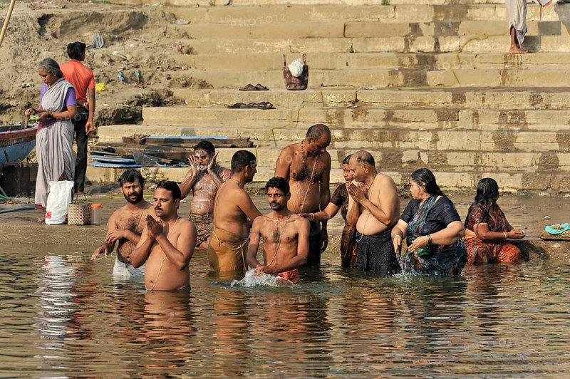 Worshippers on the banks of the Ganges during ritual ablutions in Varanasi