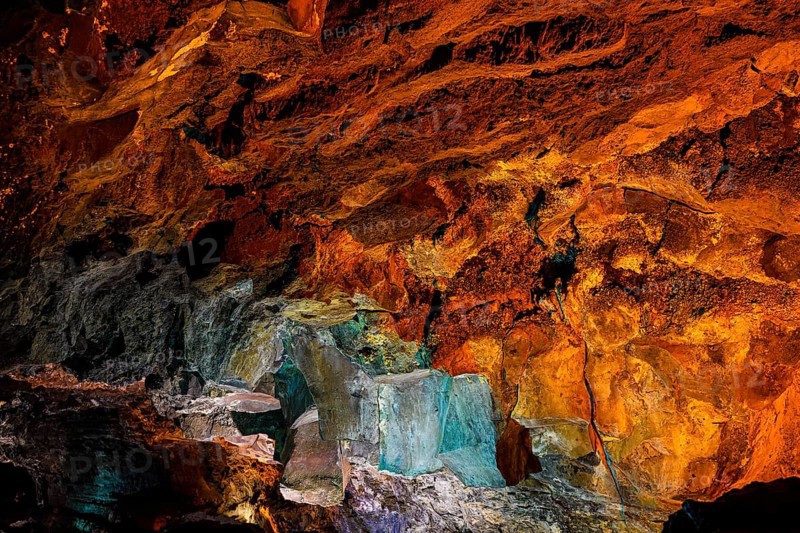 Colourfully illuminated areas of the Cueva de los Verdes