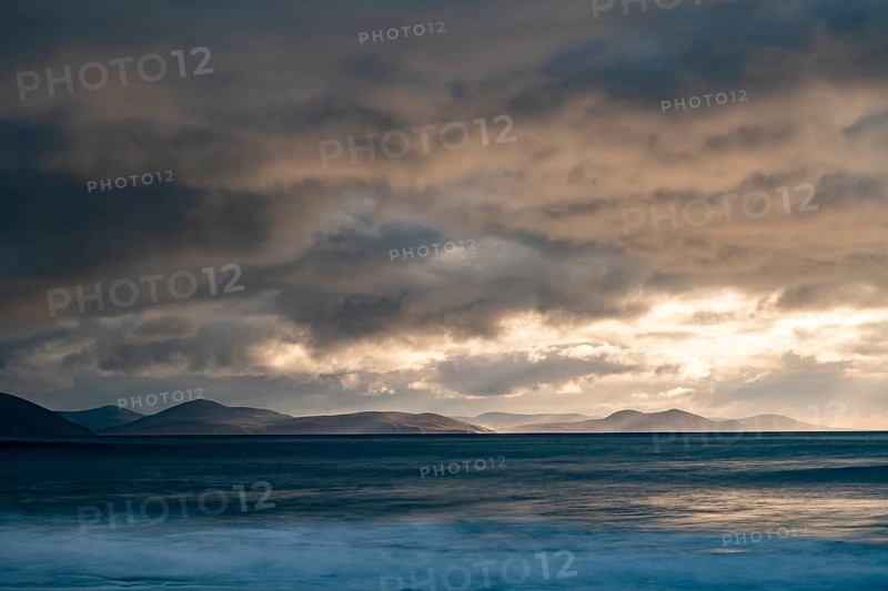 North Atlantic with rock needle and cloudy sky