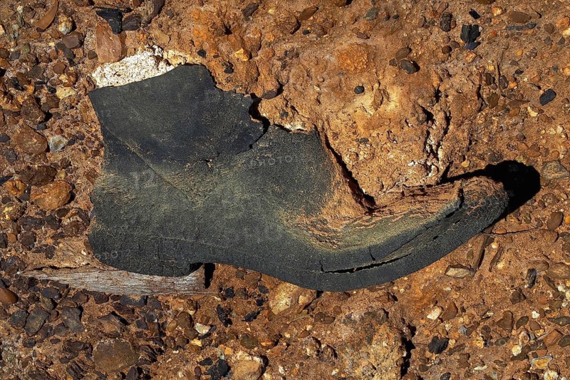 Rubber boot on red earth