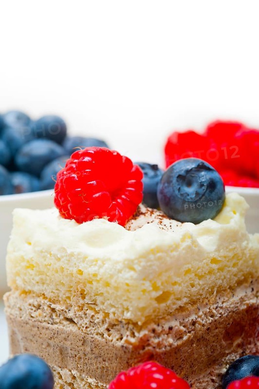 Fresh homemade raspberry and blueberry cream cake