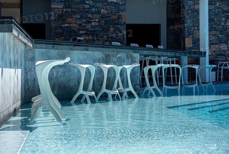 Bar and bar stools by the swimming pool