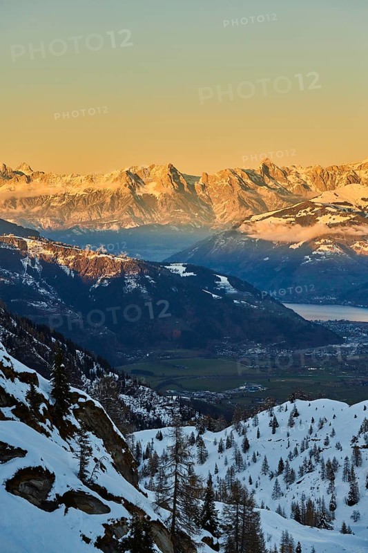 View from Mount Kitzsteinhorn on snow covered mountains down to Zell am See