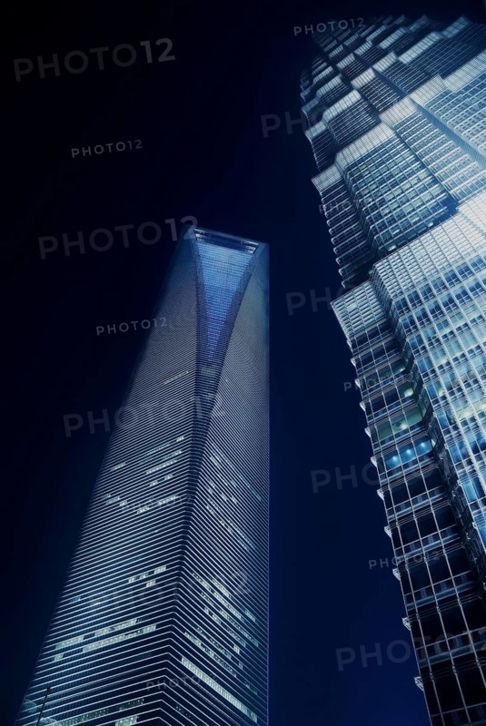 Shanghai pudong world financial center and jin mao tower illuminated by night