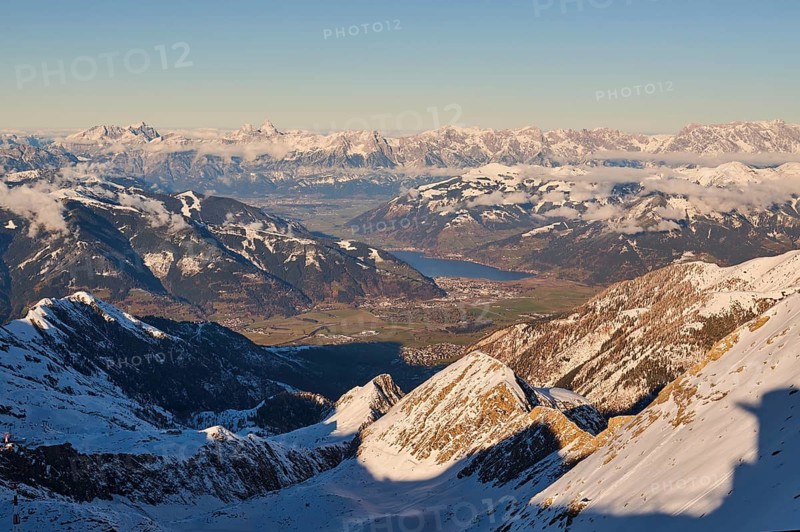 View from Mount Kitzsteinhorn on snow covered mountains down to Zell am See