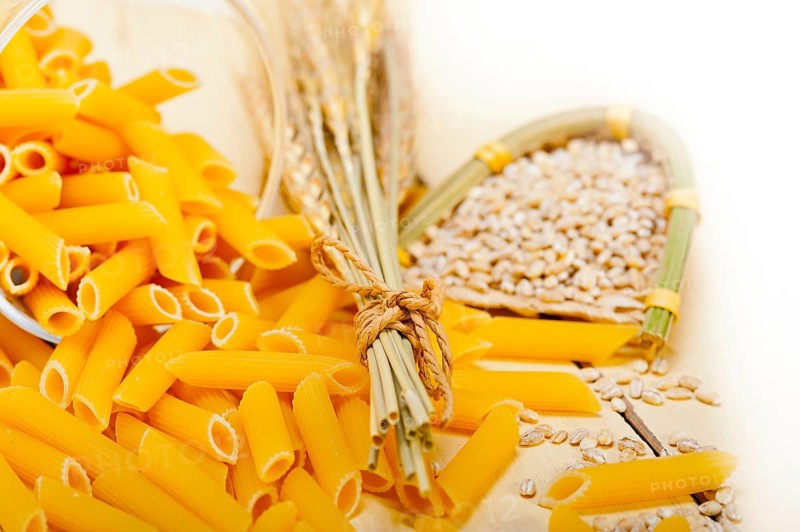 Short Italian pasta penne with durum wheat grains