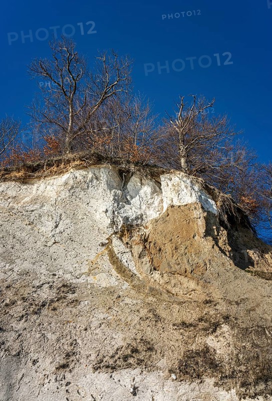 Slopes and chalk cliffs on the pebble beach of Pirate's Gorge on the island of Ruegen