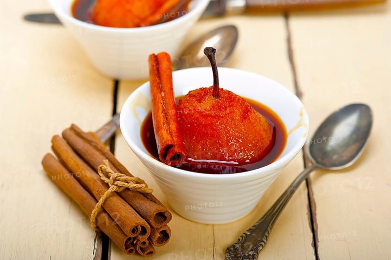 Poached pears delicious home made recipe ove white rustic wood table
