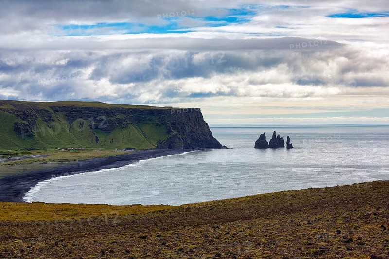 Bay with cliffs and black lava beach Reynisfjara