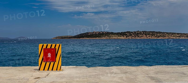 Yellow container for the fire hose at the harbour basin