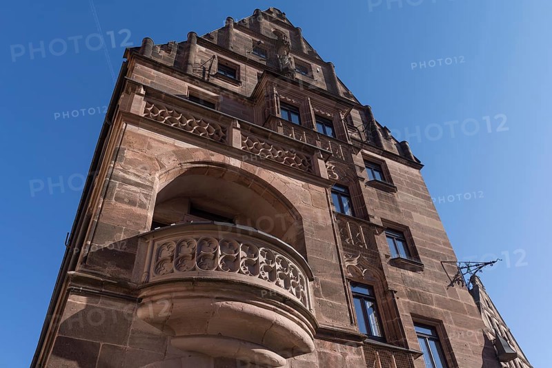 Gothic tracery of the balcony parapets of the historic Hotel Deutscher Kaiser