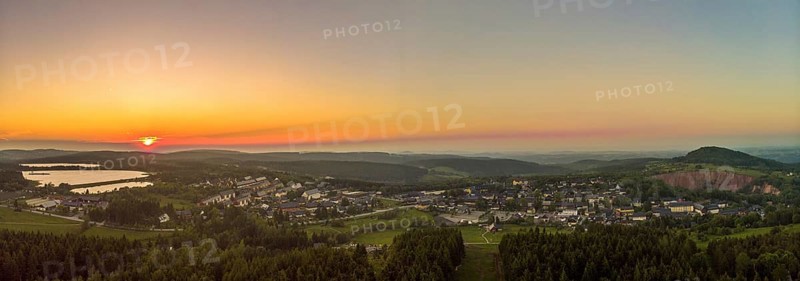 Panorama aerial view of the health resort Altenberg in the district of Saechsische Schweiz-Osterzgebirge at sunset