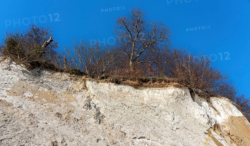 Slopes and chalk cliffs on the pebble beach of Pirate's Gorge on the island of Ruegen