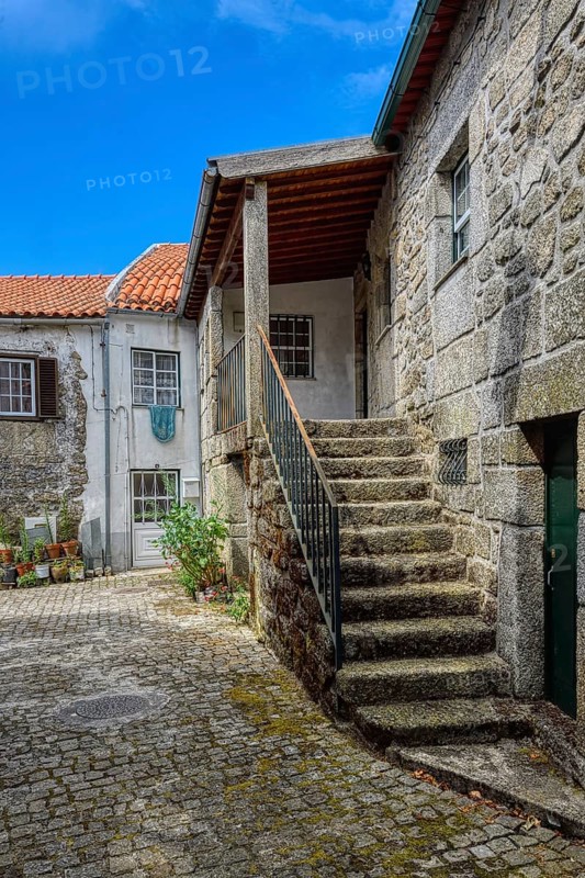 Narrow cobble street and old stone houses