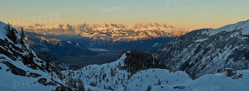 View from Mount Kitzsteinhorn on snow covered mountains down to Zell am See