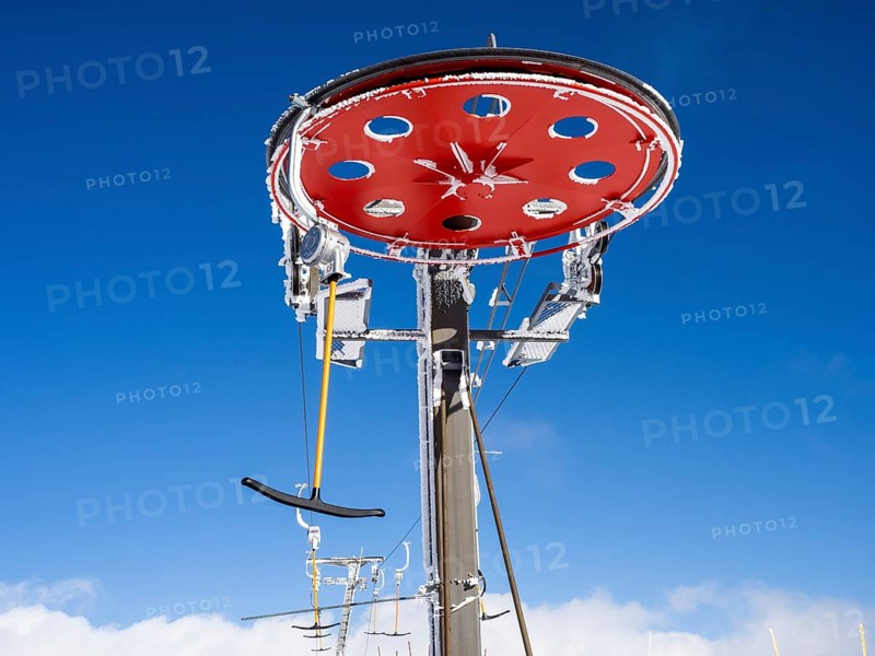 Blue sky above drag lift