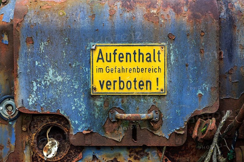 Prohibition sign on old machine door