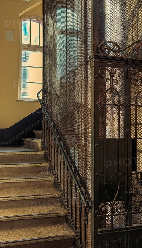 Ornate door from a historic lift in an old factory