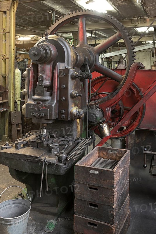 Eccentric press for valve blanks in a former valve factory