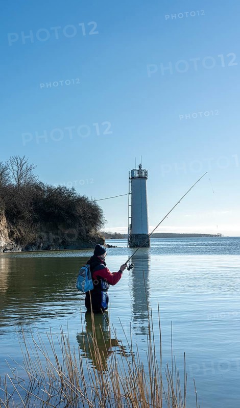 Anglers at the Maltzien lighthouse on the island of Ruegen