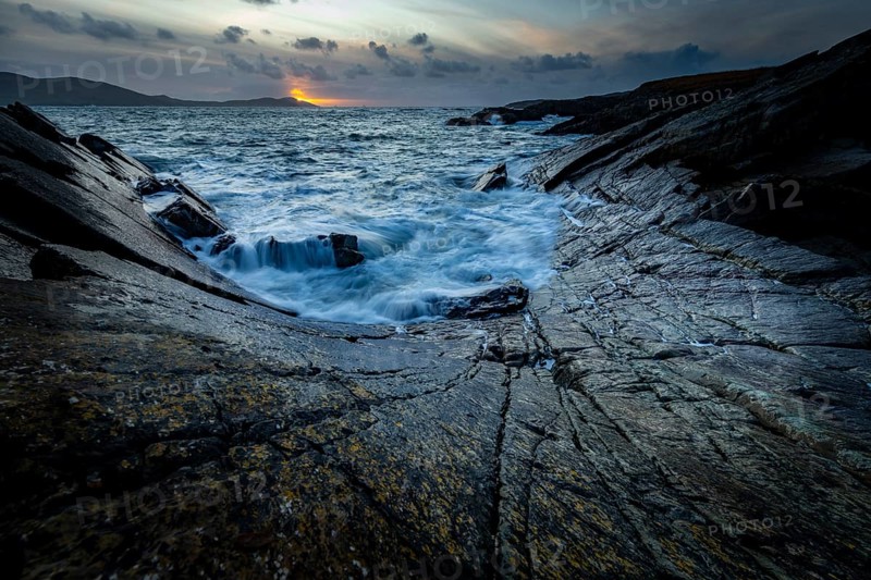 Sea surf on rocky coast