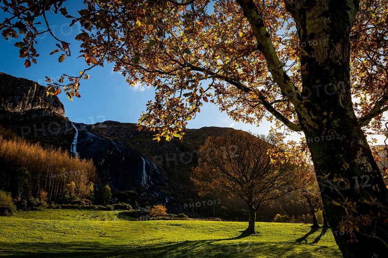 Waterfall in autumn landscape
