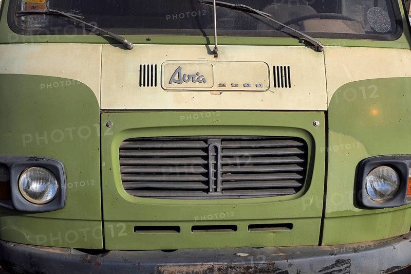 Front view of lime green Avia van