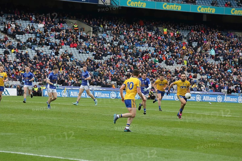 Gaelic football player with ball in hand during match in Dublin