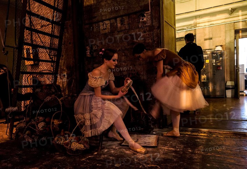 Ballet dancers in the wings preparing themselves to get onstage during the performance of Tchaikovsky s Swan Lake in St. Petersburg