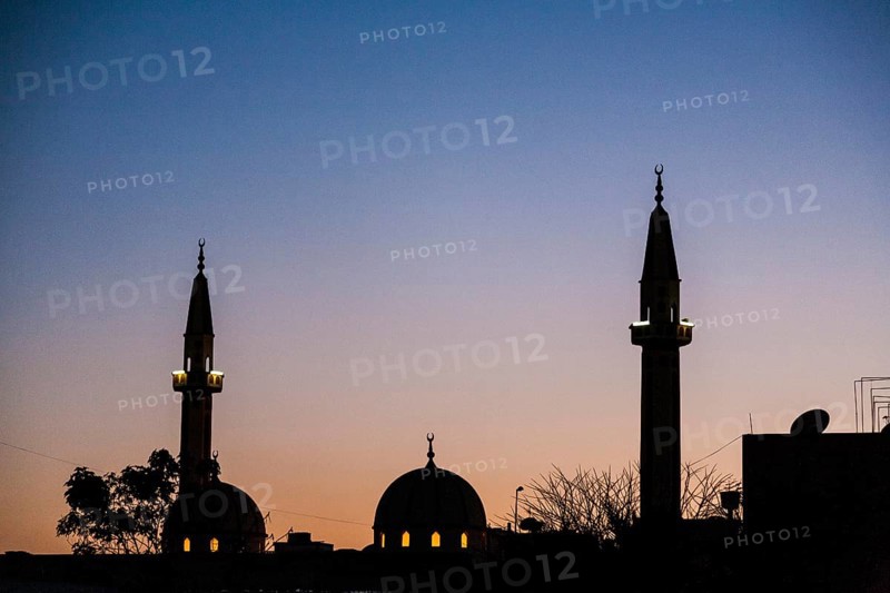 Silhouette of minarets and domes on a Mosque part of the skyline of Tripoli