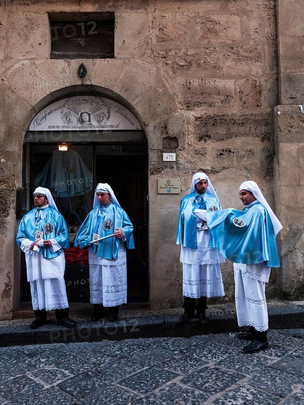 Members of a brotherhood during Good Friday in the streets of Enna