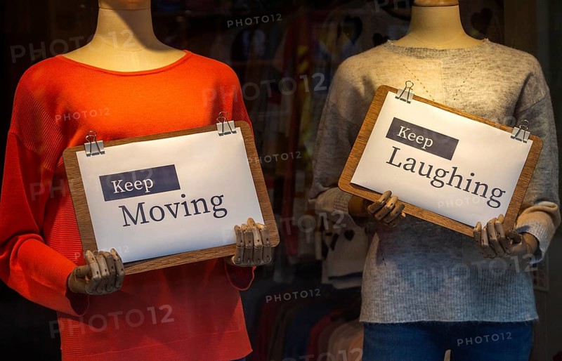 Positive messages during Covid coronavirus lockdown held by mannequins in shop window