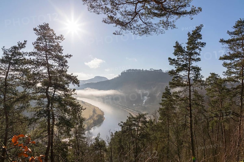View from the Biedermann Mausoleum into the Elbe Valley with Koenigstein Fortress in the morning mist