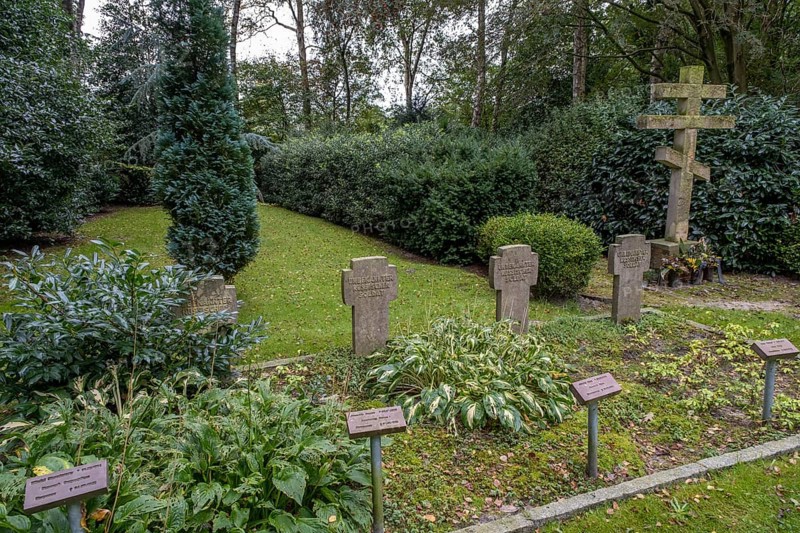 Gravestones for unknown Russian soldiers and orthodox Russian cross at the cemetery for Soviet prisoners of war from WW2