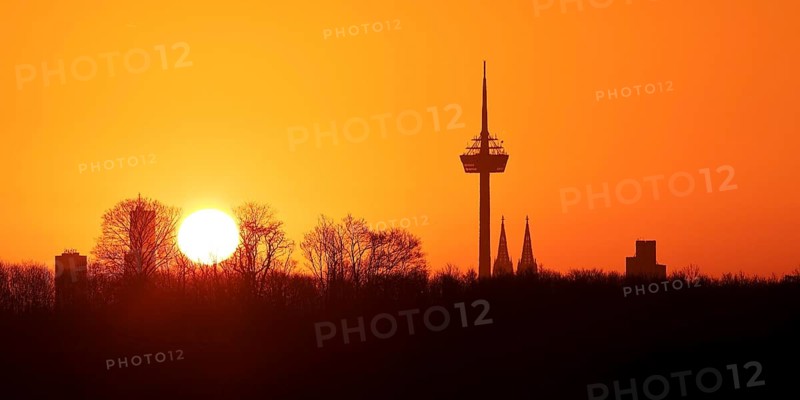 Sunrise over the city skyline with the Colonius telecommunications tower and the cathedral