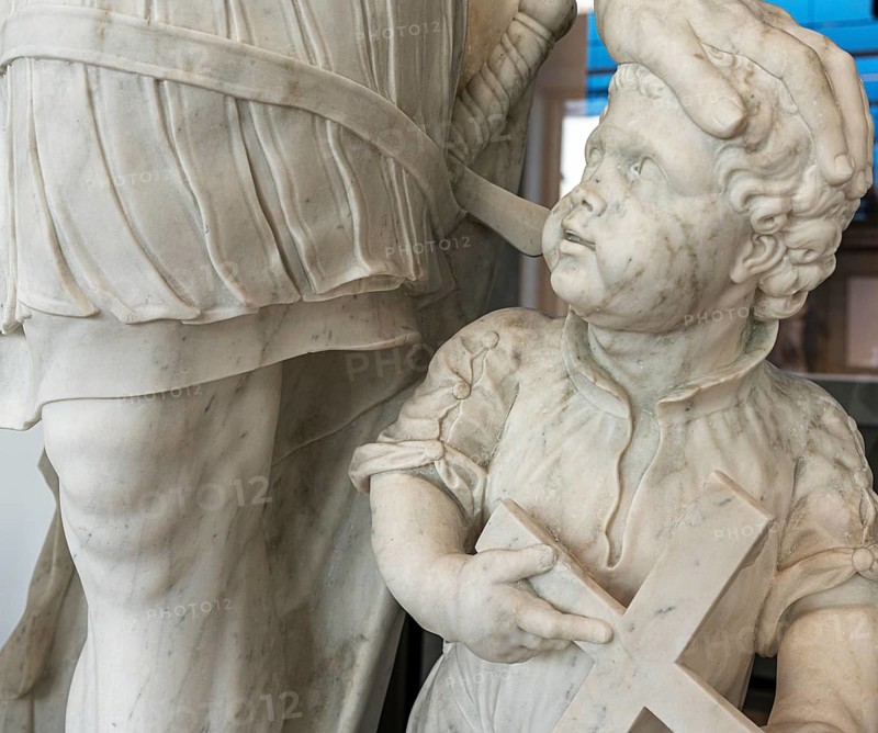 Marble statue of an ancient warrior with child in the staircase of the Humboldt Forum