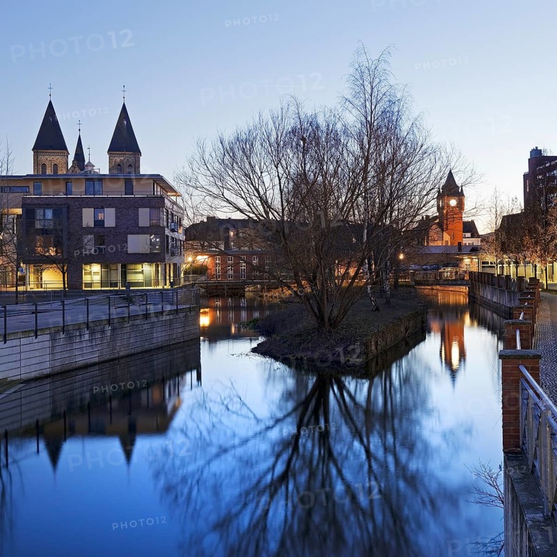 St. Anthony's Parish Church and Old Town Hall Tower with the River Dinkel in the Evening