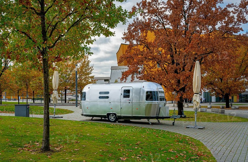 Retro caravan stands in the park next to the Philharmonie