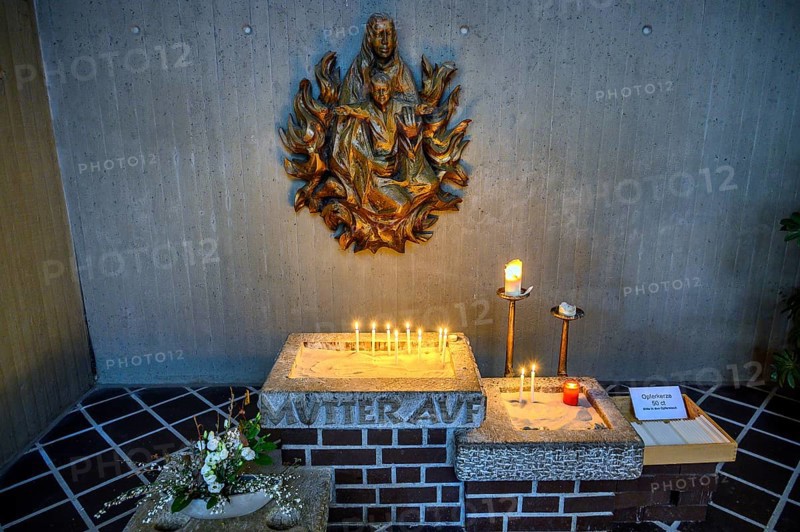 Relief of the Virgin Mary with Christ Child and sacrificial candles