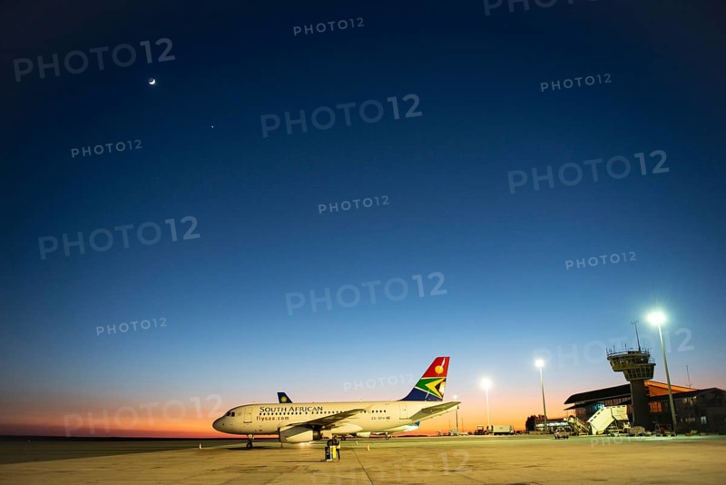South African Airline on tarmac at sunrise