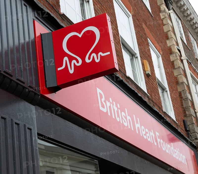 Wall mounted sign outside British Heart Foundation charity shop