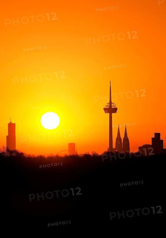 Sunrise over the city skyline with the Colonius telecommunications tower and the cathedral
