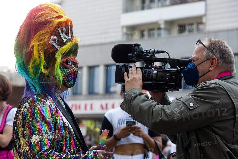 Colourful outfit and first interview at start of 2021 Christopher Street Parade. Berlin