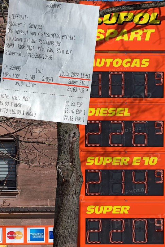 Fuel receipt and electronic price board of a petrol station with over two euros per litre