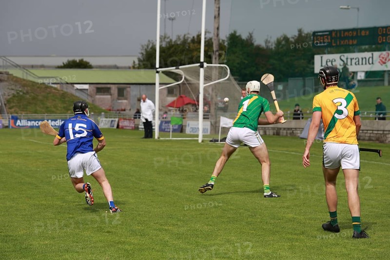 GAA player with hurley and ball during a game as Lixnaw win Kerry county hurling county final