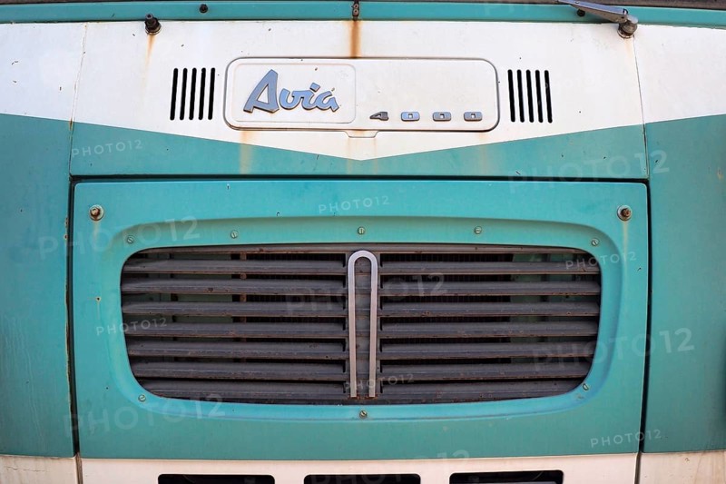 Front view of mint green Avia van